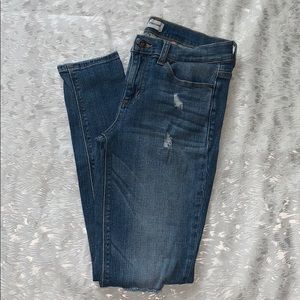 Gently used mid-rise distressed skinny jeans